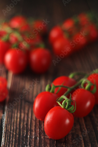 Cherry tomatoes on the table in low key	