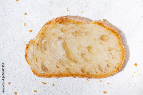 slice of baguette on a white background