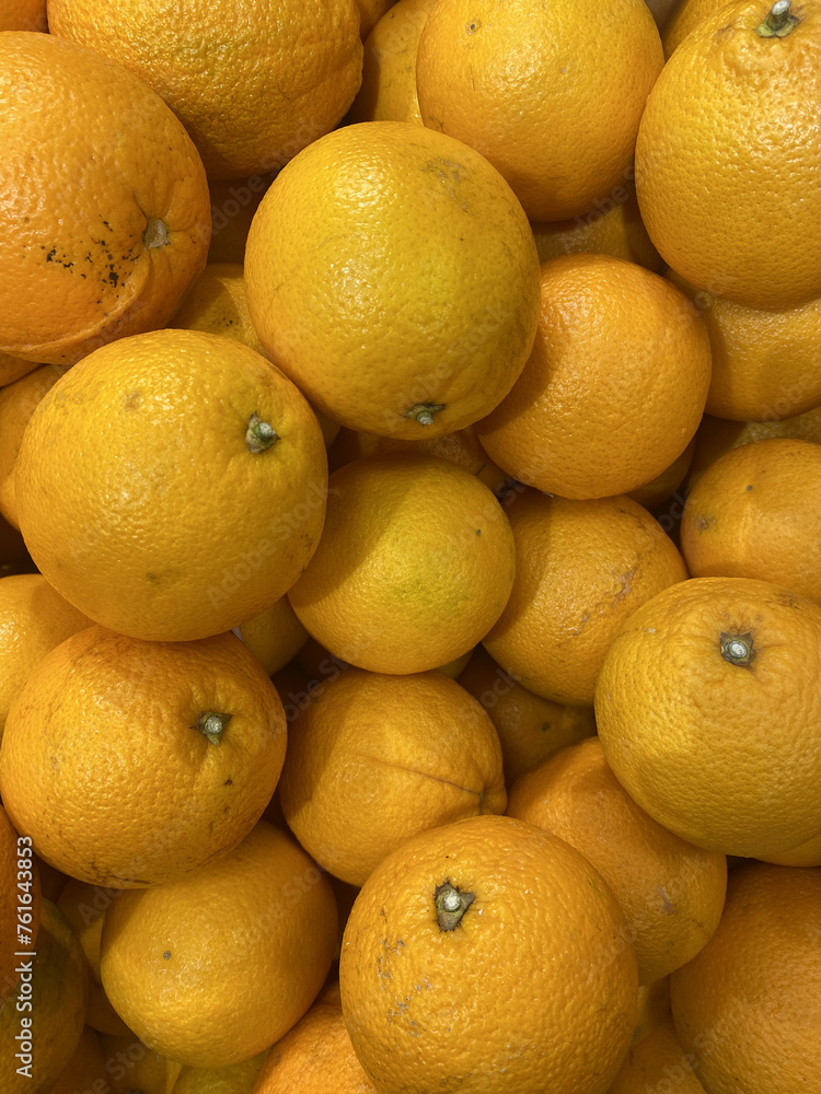 A lot of oranges are in the juice box, ripe, yellow, sweet A lot of oranges are in the juice box, ripe, yellow, sweet