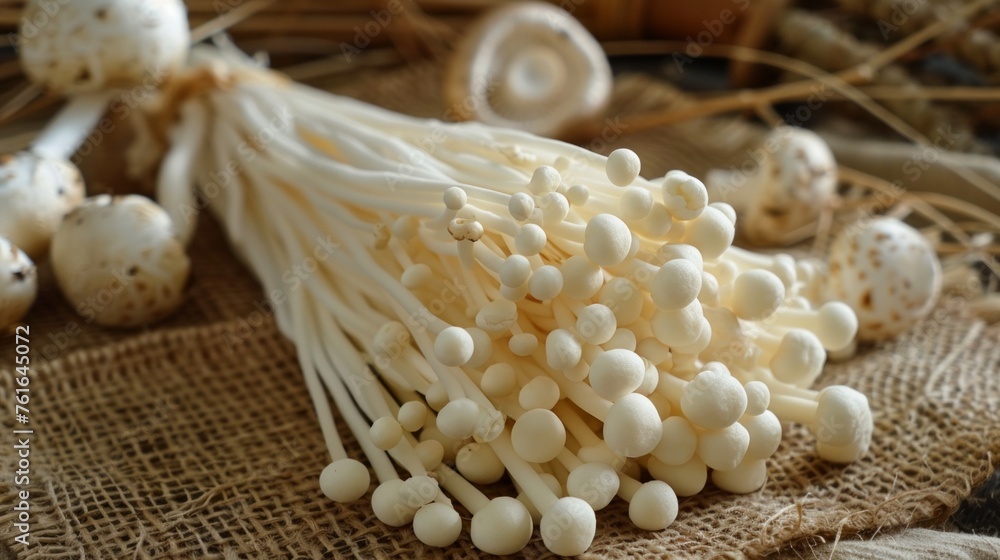 Enoki mushroom on wooden table for cooking Enoki mushroom on wooden table for cooking