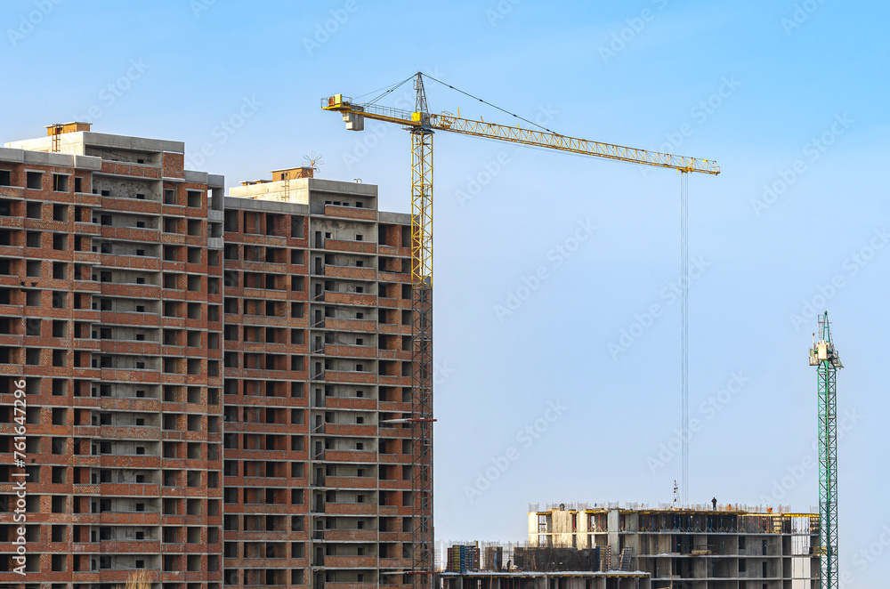 Cranes. Construction of a multi-storey residential building.