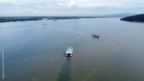 Aerial view of a ferry sailing on the sea to transport passengers photo