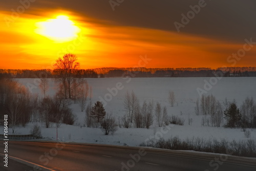 Russia. The South of Western Siberia. Morning colors of the rising sun on a frosty morning in the suburbs of Novokuznetsk.