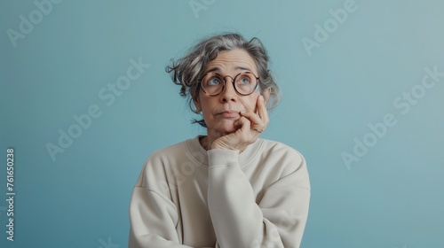 Pensive Senior Woman with Upturned Palms