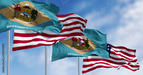 Delaware state flag waving with the national american fla