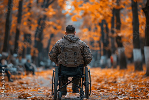 Wallpaper Mural back of a military disabled soldier man in a invalid wheelchair on a walk in the park in autumn Torontodigital.ca