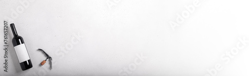 Decanter, glass and bottle with red wine on white. Flat lay. Long banner photo