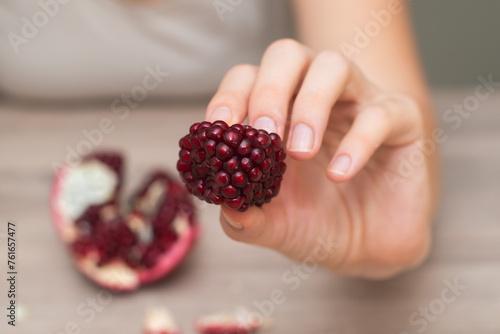 Wallpaper Mural Female Hands Holding Open Pomegranate. Cradling a freshly opened pomegranate revealing juicy seeds. Torontodigital.ca