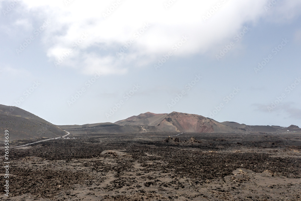 Wild and deserted volcanic landscape of the Timanfaya National park, Lanzarote, Canary islands Wild and deserted volcanic landscape of the Timanfaya National park, Lanzarote, Canary islands