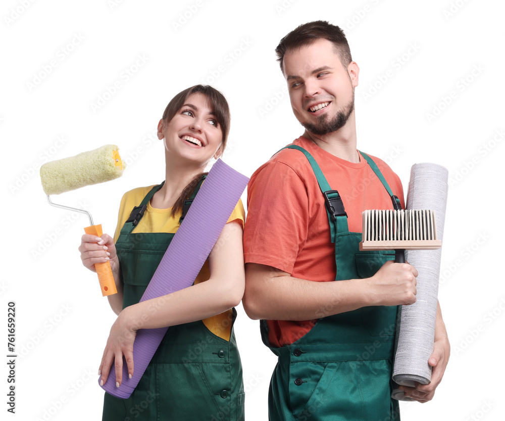 Workers with wallpaper rolls, roller and brush on white background Workers with wallpaper rolls, roller and brush on white background