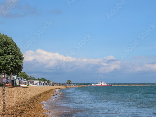 beach huts on the beach at Calshot Hampshire England photo