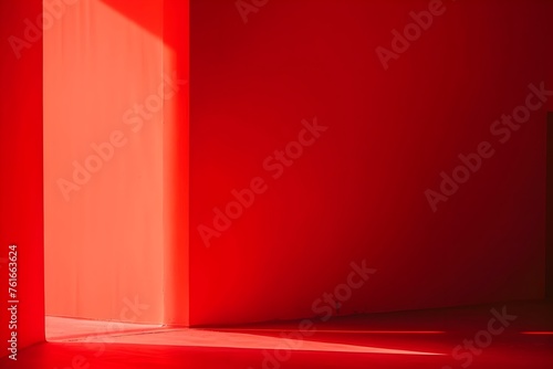 Minimalist Red Room Illuminated by Soft Light from Doorway © Duanporn