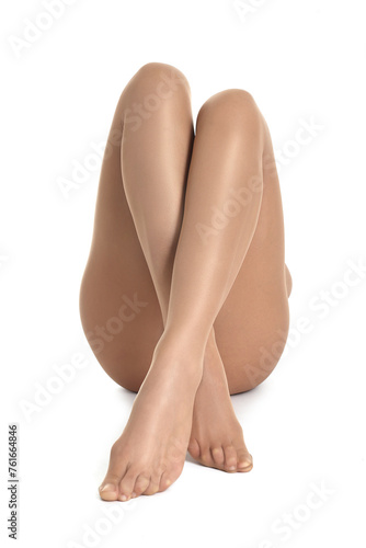 Woman with beautiful long legs wearing tights on white background