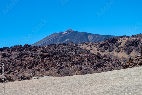 View of Teide volcano and the caldera ridge in behind the pumice and lava fields, Teide National Park, Tenerife, Spain photo