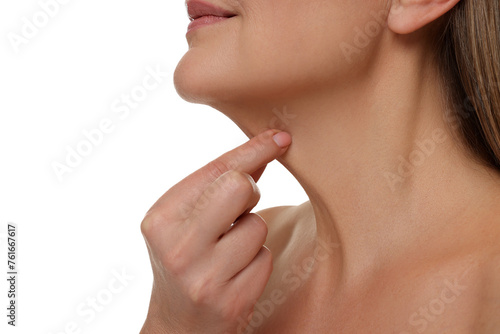 Mature woman touching her neck on white background  closeup