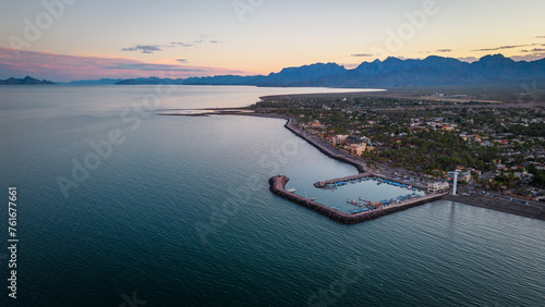 drone fly above Loreto Baja California Sur Mexico old colonial town with sea gulf ocean and mountains desert landscape at sunset photo