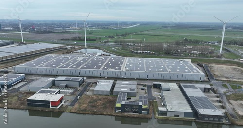 Aerial drone view on a solar powerd energy distribution center in The Netherlands. Logistics and sustainable company. Top down overview. photo