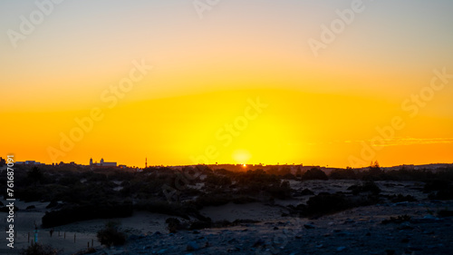 Sunset, Moon and Evening Sky over Maspalomas on Gran Canary Island Spain.