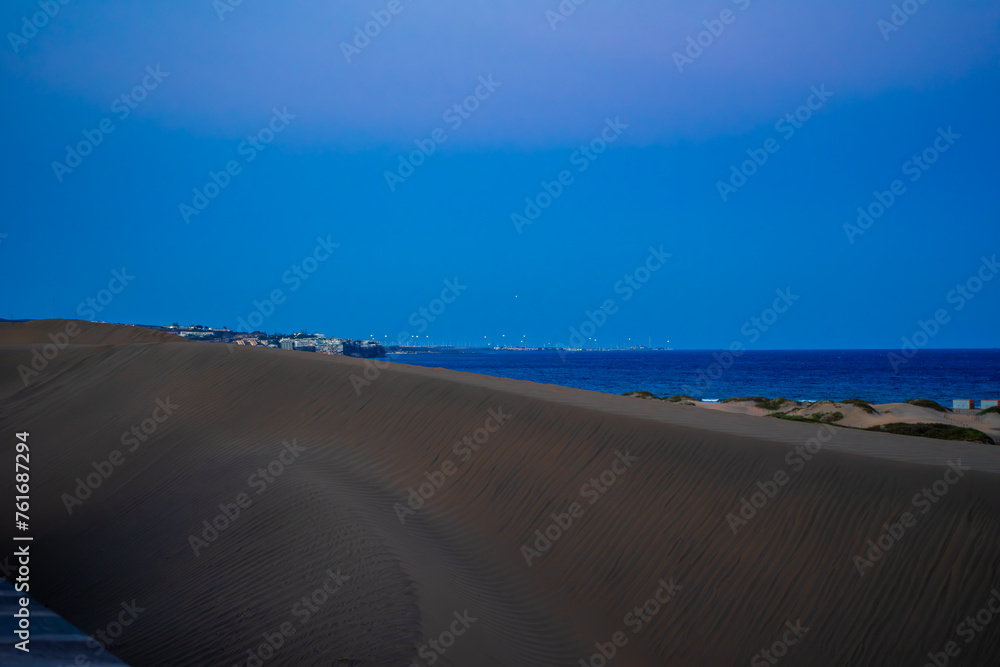 Sunset, Moon and Evening Sky over Maspalomas on Gran Canary Island Spain. Sunset, Moon and Evening Sky over Maspalomas on Gran Canary Island Spain.