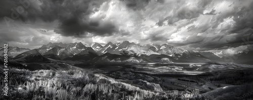 Professional monochrome panorama of snowy mountain range in clouds and wildlife nature. Graphic black and white poster of wild landscape. Photo shot for interior painting.