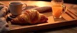 Breakfast served with croissants and orange juice, coffee or milk