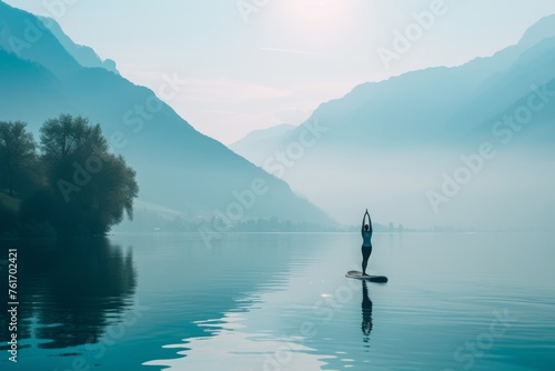 A person confidently stands on a paddle board, gracefully balancing on the waters surface, A person doing yoga on a paddleboard on calm water, AI Generated © Iftikhar alam