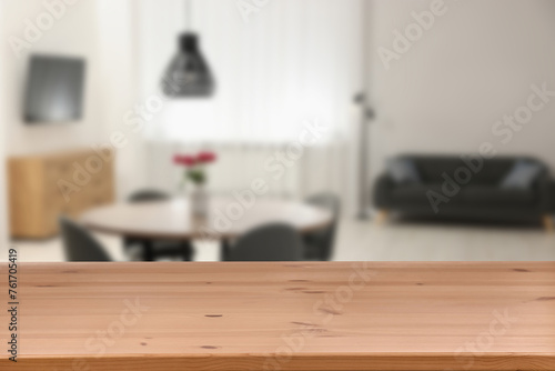 Empty wooden table in dining room. Space for design