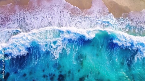 Aerial View of Waves Crashing on a Colorful Shoreline