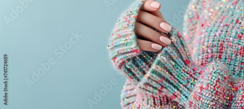 Female hand with white nail art and glitter polish in pastel sweater, elegant manicure