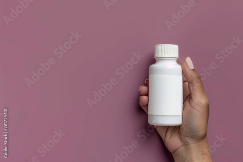 Close-up shot of a hand gripping an empty white skincare product bottle on a muted plum isolated solid background  promoting calm and elegance in skincare 