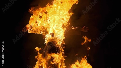 Burning an effigy of the victim at the stake.Witch rituals,Halloween.Burning witches in the dark is a religious tradition.A nightmare,horror.The mystery of evil,magic and mysticism.Esoteric sacrifice photo
