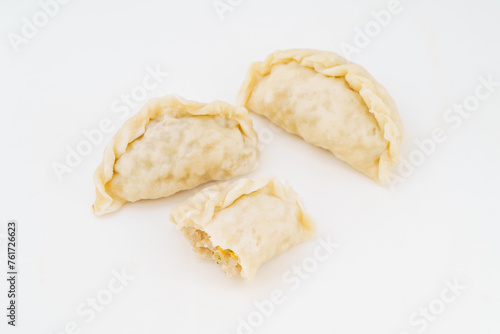 Northeastern large dumplings with vegetarian stuffing on white background