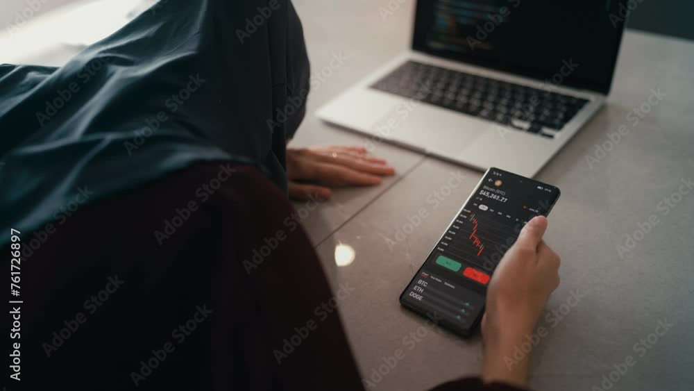 Disappointed Arab woman watching bitcoin collapse on mobile cryptocurrency app Disappointed Arab woman watching bitcoin collapse on mobile cryptocurrency app