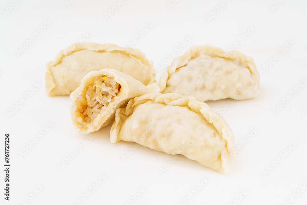 Northeastern large dumplings with vegetarian stuffing on white background