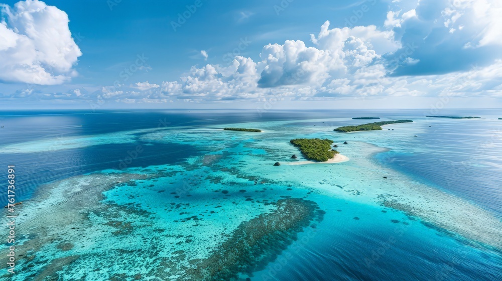 Obraz premium A birds eye view of an island surrounded by vast ocean waters.