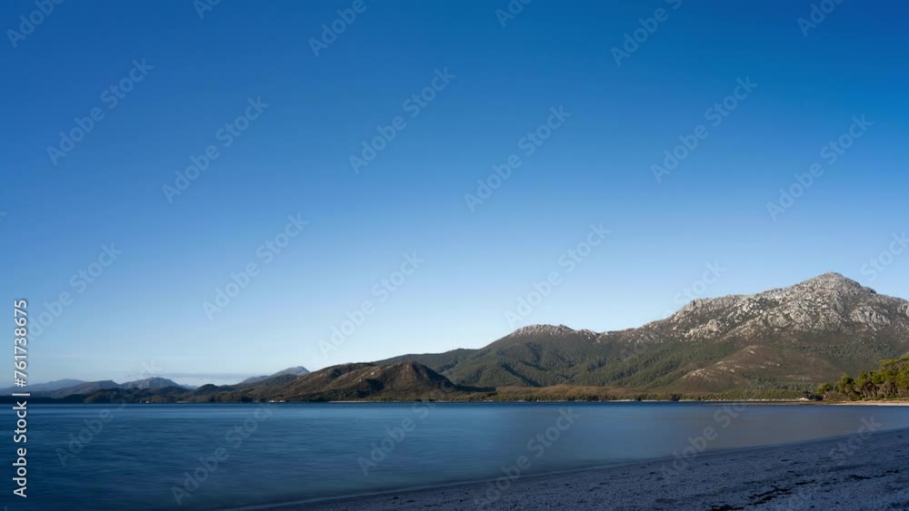 timelapse of moon rising at dusk beautiful rock mountain above the ocean in a national park timelapse of moon rising at dusk beautiful rock mountain above the ocean in a national park