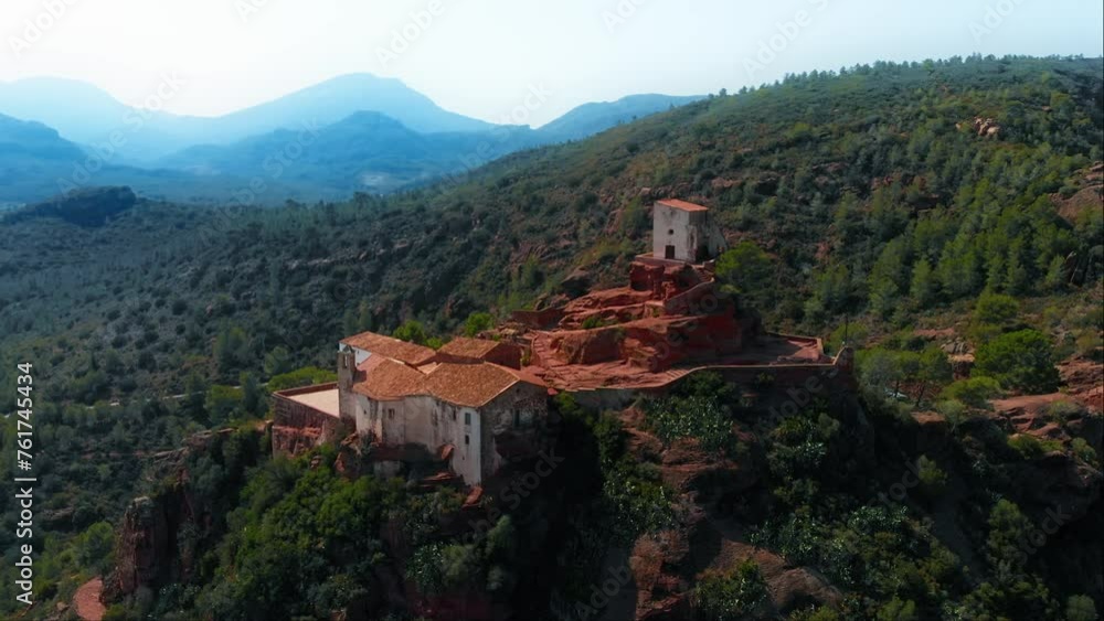 Old castle or monastery nestled on a hilltop surrounded by majestic mountains, with picturesque views of the natural landscape, aerial drone shot Old castle or monastery nestled on a hilltop surrounded by majestic mountains, with picturesque views of the natural landscape, aerial drone shot