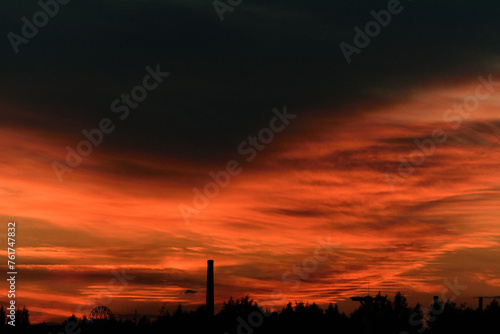 Obraz na płótnie Black and red heavy sky after sunset, evening dark twilight w salonie