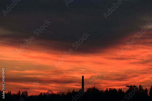 Obraz na płótnie Black and red heavy sky after sunset, evening dark twilight w salonie