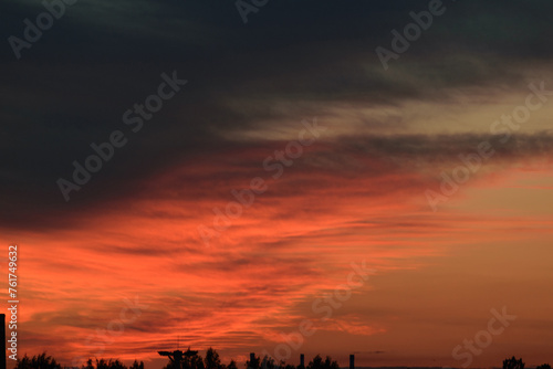 Black and red evening sky above the horizon, night twilight, dramatic atmosphere
