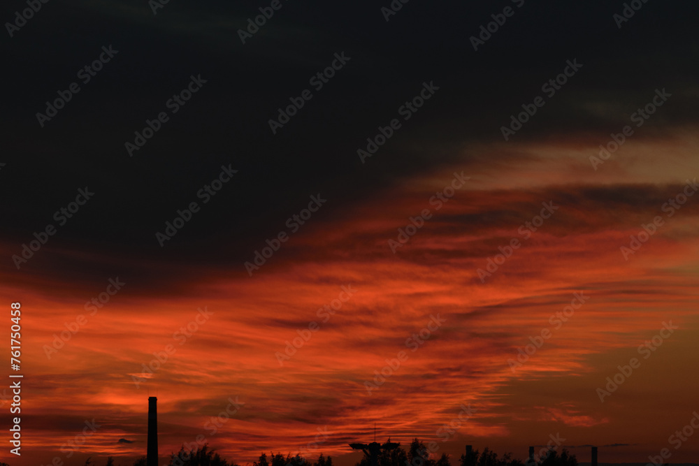 Black and red evening sky above the horizon, night twilight, dramatic atmosphere