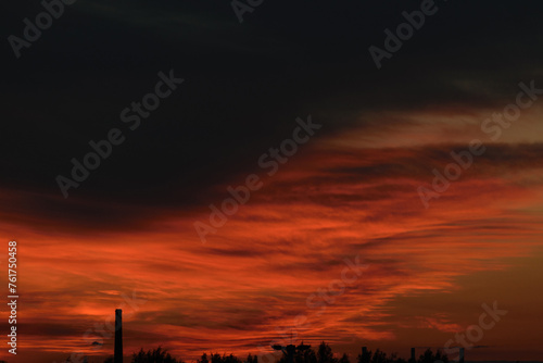 Obraz na płótnie Black and red evening sky above the horizon, night twilight, dramatic atmosphere w salonie