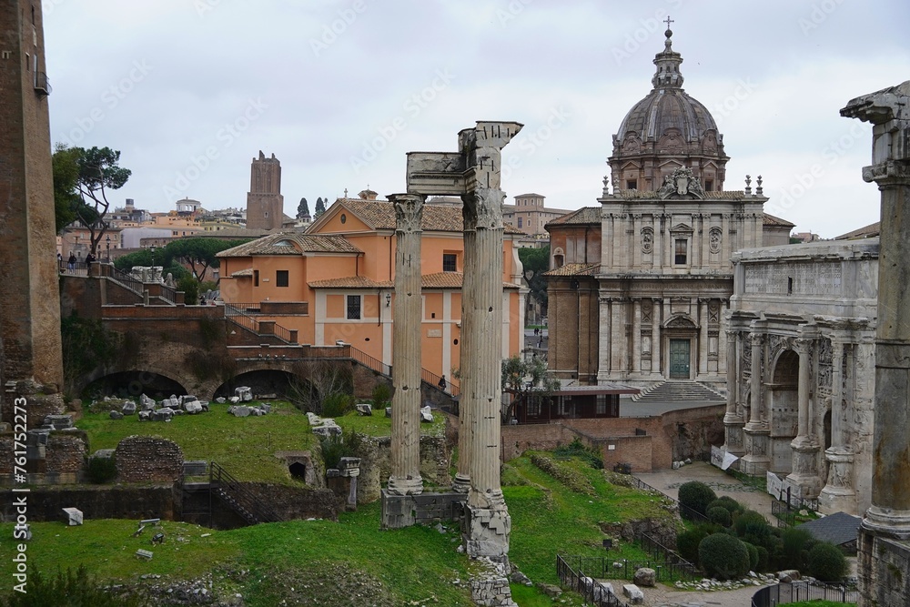 Columns of the Temple of Concord, the arch of Septimius Severus and a Christian church, in the Roman forum, in Rome, Italy