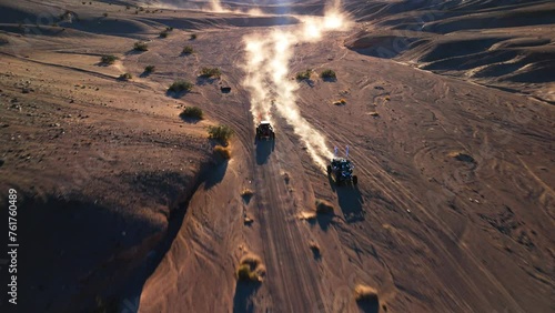 Side By Side UTVs racing in the desert canyon