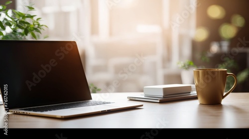 Blurred Background White Desk with Red Coffee Mug and Laptop 