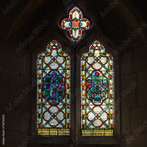 Stained glass window in the church of Saint Mary Magdalene in the village of Boddington near Cheltenham Gloucestershire UK photo