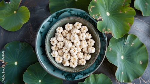 Makhana, commonly known as fox nuts or lotus seeds, are nutritious seeds harvested from the Euryale ferox plant, a member of the water lily family, predominantly grown in Asian wetlands and ponds. photo