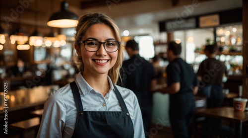 Joyful waitress donning glasses working in lively cafe atmosphere 