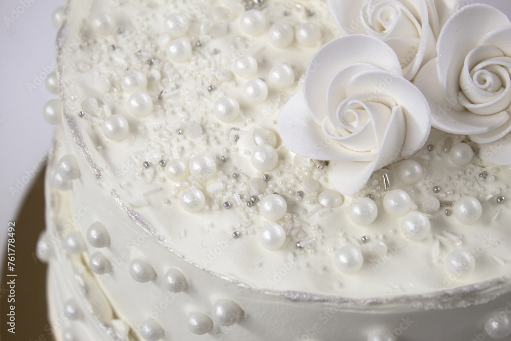 White party cake with white icing and pearls, cake design. Handmade cake made for a special celebratory occasion. Special details. White party cake with white icing and pearls, cake design. Handmade cake made for a special celebratory occasion. Special details.