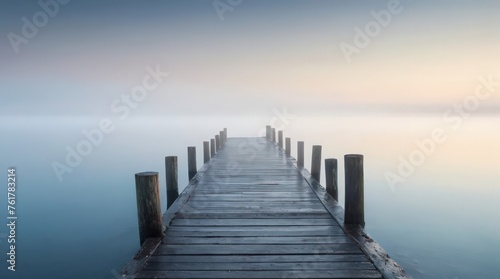 bridge in a lake and fog photo